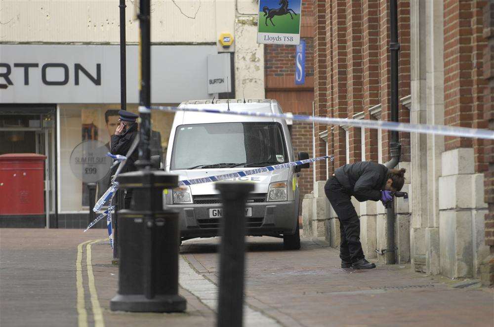 Forensic officers in Ashford town centre after the stabbing