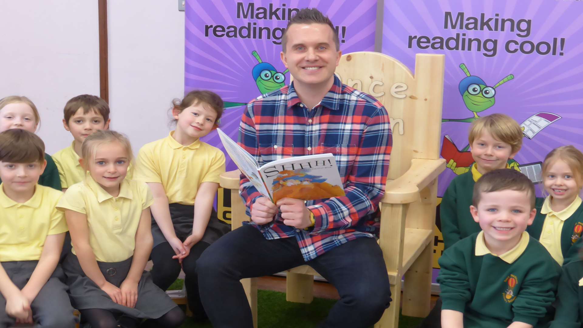 Phil Gallagher, star of Cbeebies' Mister Maker, attends a special storytime session for KM Walk to School award winners East Peckham Primary School.