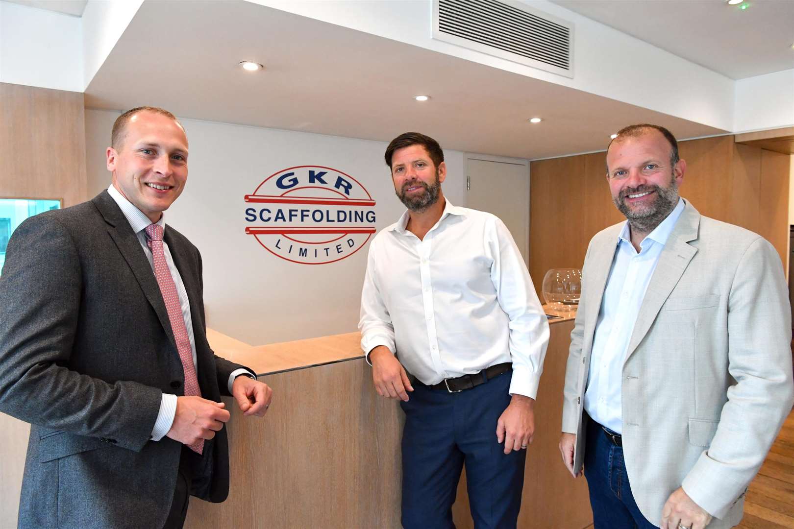 Barclays relationship director Andrew Burton with directors of GKR Scaffolding Neil and Lee Rowswell at their new offices on Tower Bridge Road, London (4444114)