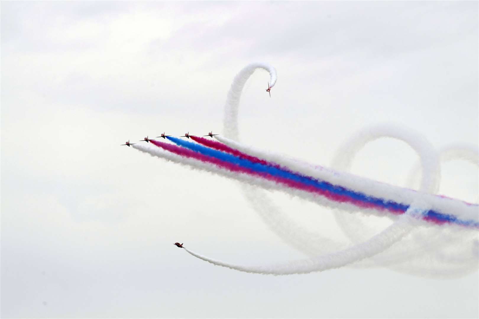 The aerial acrobatics team left red, white and blue smoke trails across the sky. Picture: Barry Goodwin