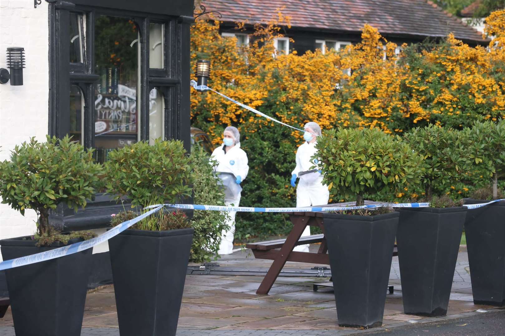 Forensics officers outside the Cricketers pub in Meopham following the fatal stabbing