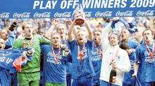 The Gills players celebrate with the trophy