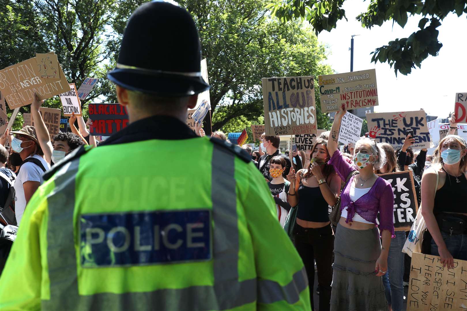 Police kept the protesters away from a group gathered at the city’s war memorial (Andrew Matthews/PA)