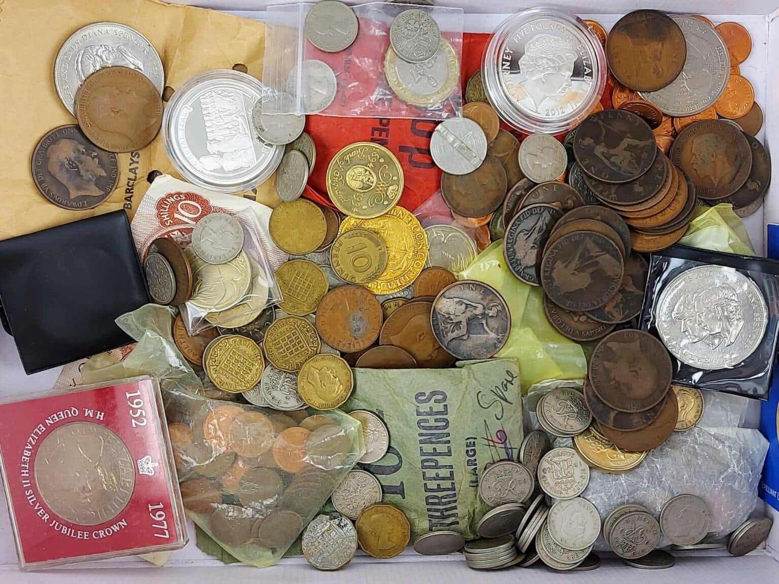 The Charles I gold coin was spotted among this collection of old coins and banknotes. Picture: Hansons Auctioneers