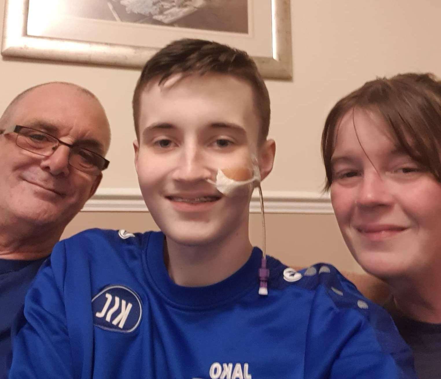Jack Rear with his parents Emma and Shane