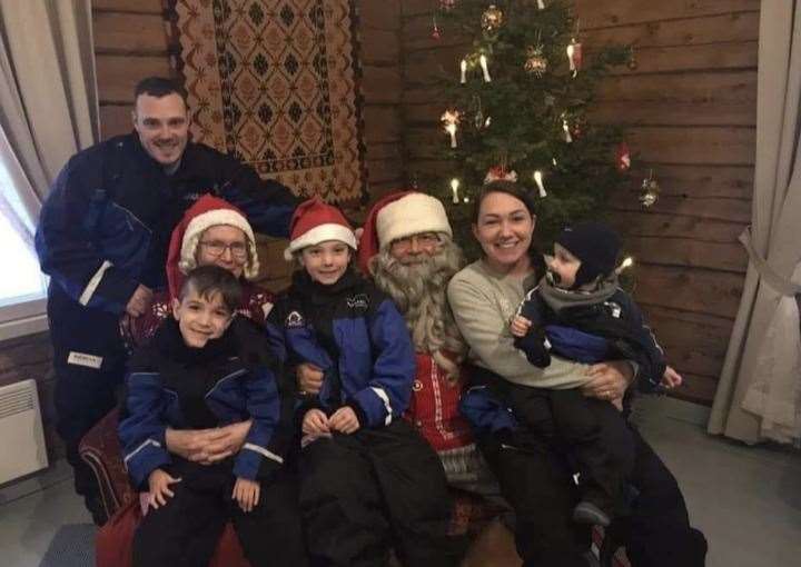 Ralphy (far left), on a Christmas trip with his family. Ralphy's parents are determined to make special memories for him