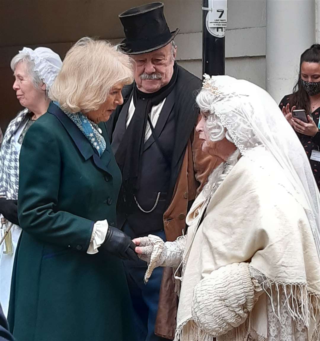 The Duchess of Cornwall speaking to one of the Victorian costumed characters from The Rochester and Chatham Dickens Fellowship.