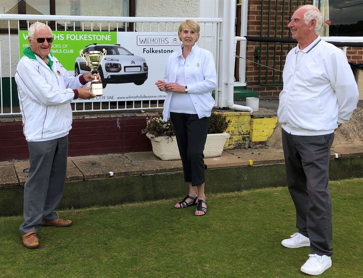 Cheriton Bowls Club's President Hugh Coleman presents the Wilmoths Trophy to Ann Russell and John Gleeson. (42110982)