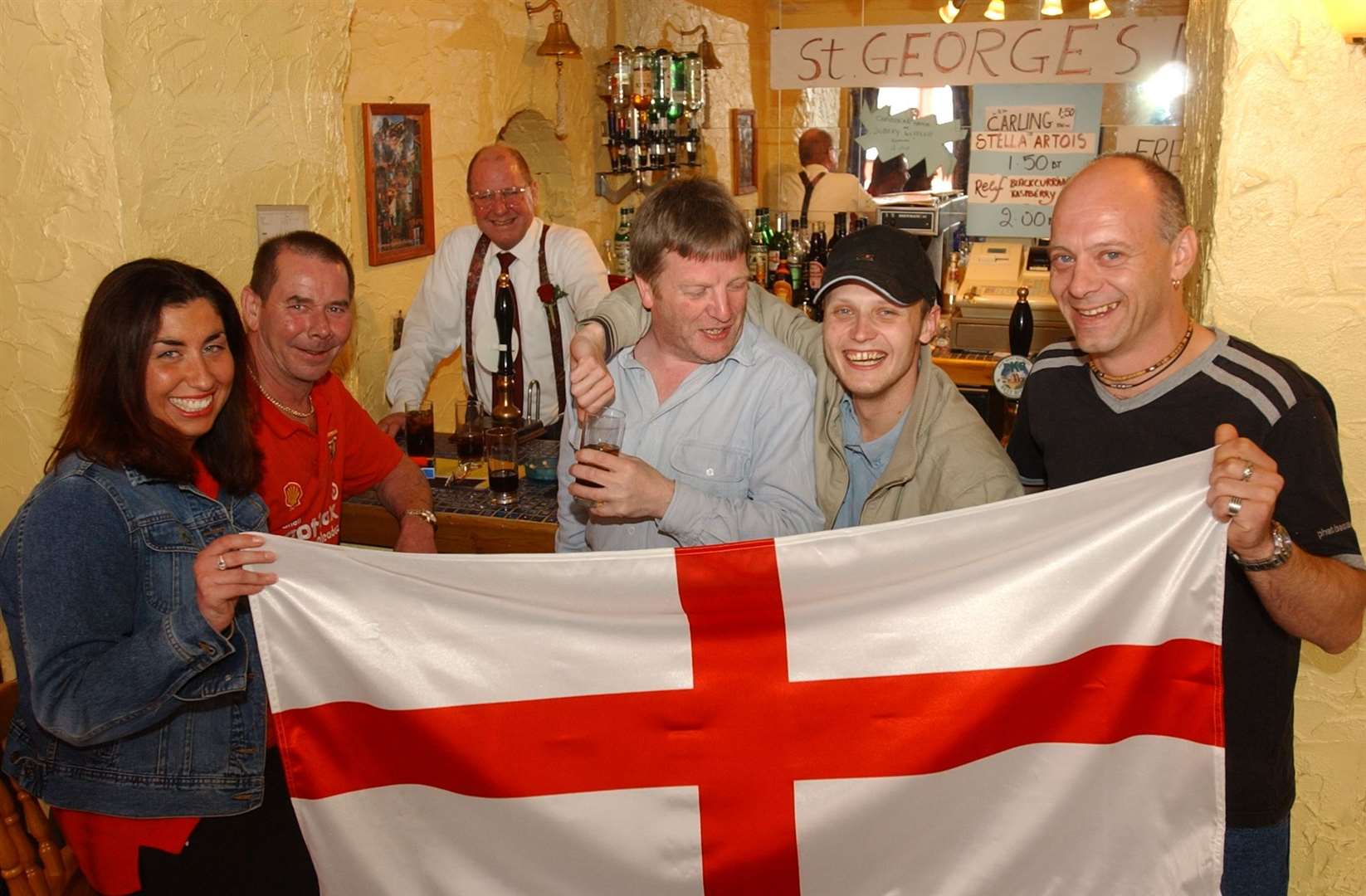 Landlord Peter Martini with friends celebrating St George's Day with flags and free buffet in the evening at The Renaissance pub in Dover in April 2002. It sadly closed in 2010. Picture: Matt McArdle