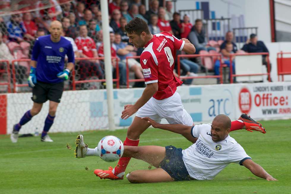 Ebbsfleet's Michael Thalissitis is beaten by some strong defending from Havant's Jake Newton. Picture: Andy Payton