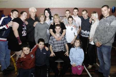 Will Roberts with some of his family and friends at his welcome home party held in the Northgate Community Centre on Saturday evening