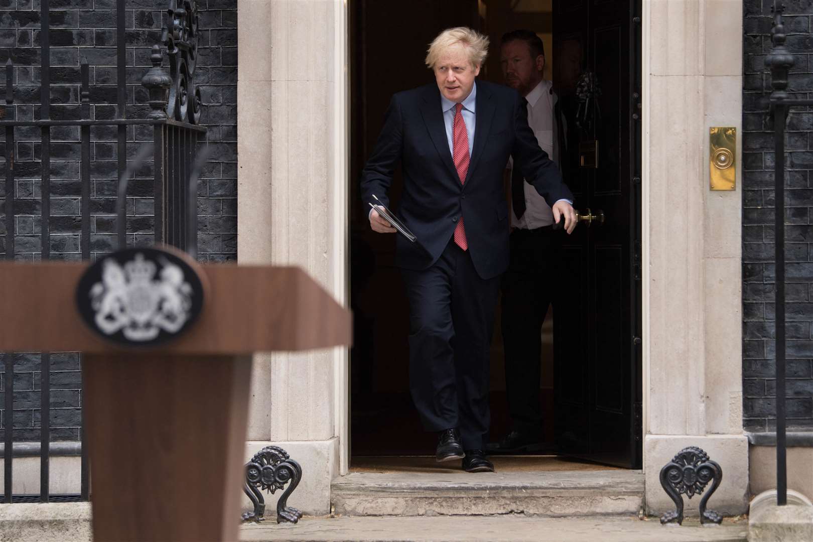 Prime Minister Boris Johnson makes a statement outside 10 Downing Street (Stefan Rousseau/PA)