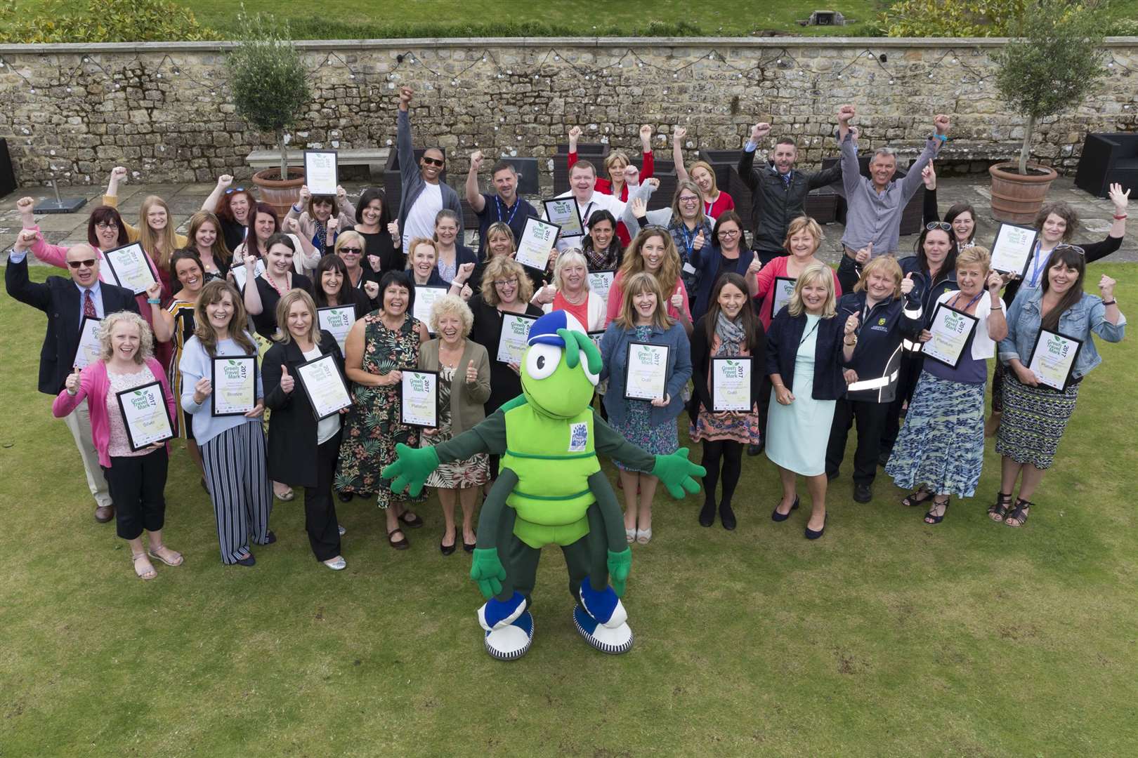 Last year's winners at the Green Travel Mark Awards 2017 plus mascot Buster Bug. (1650848)