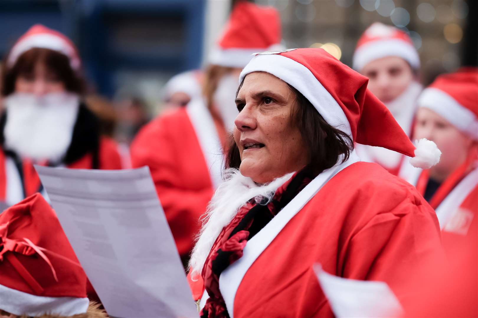 Jenny Hurkett of Minster-on-Sea Rotary Club's singing carols at the Sheppey Santa Saunter in Sheerness (20888467)