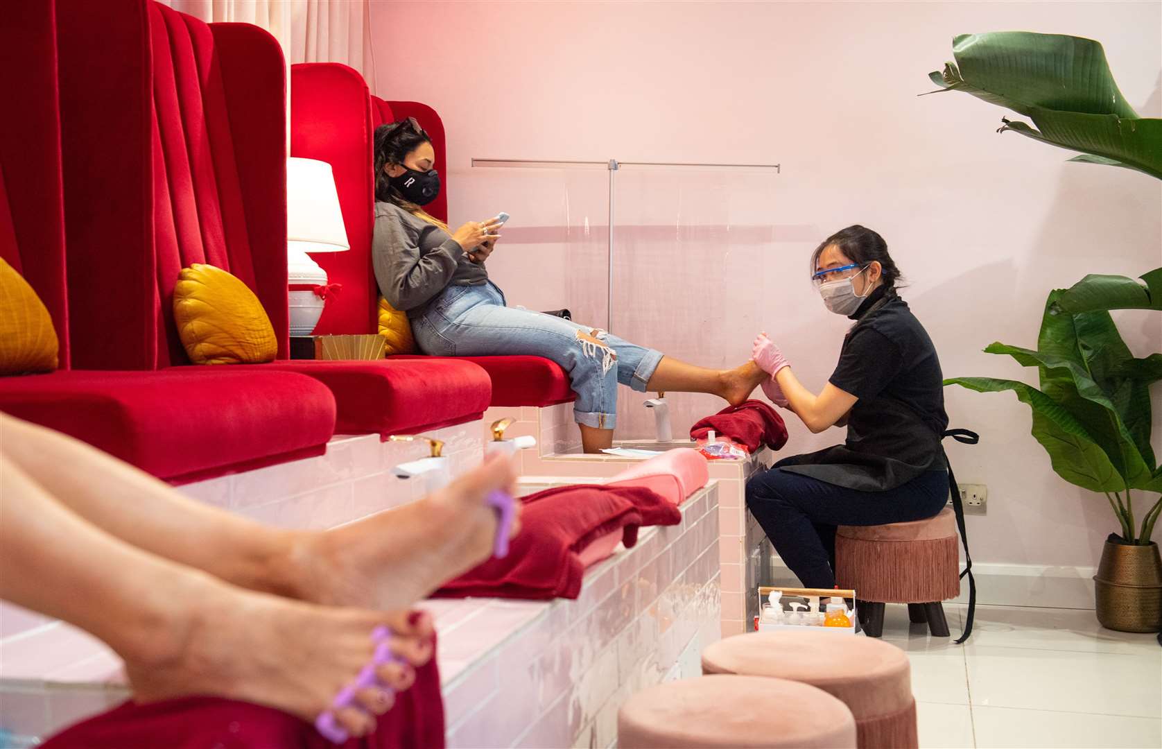 A pedicure provides a bit more distance at one London salon (Dominic Lipinski/PA)