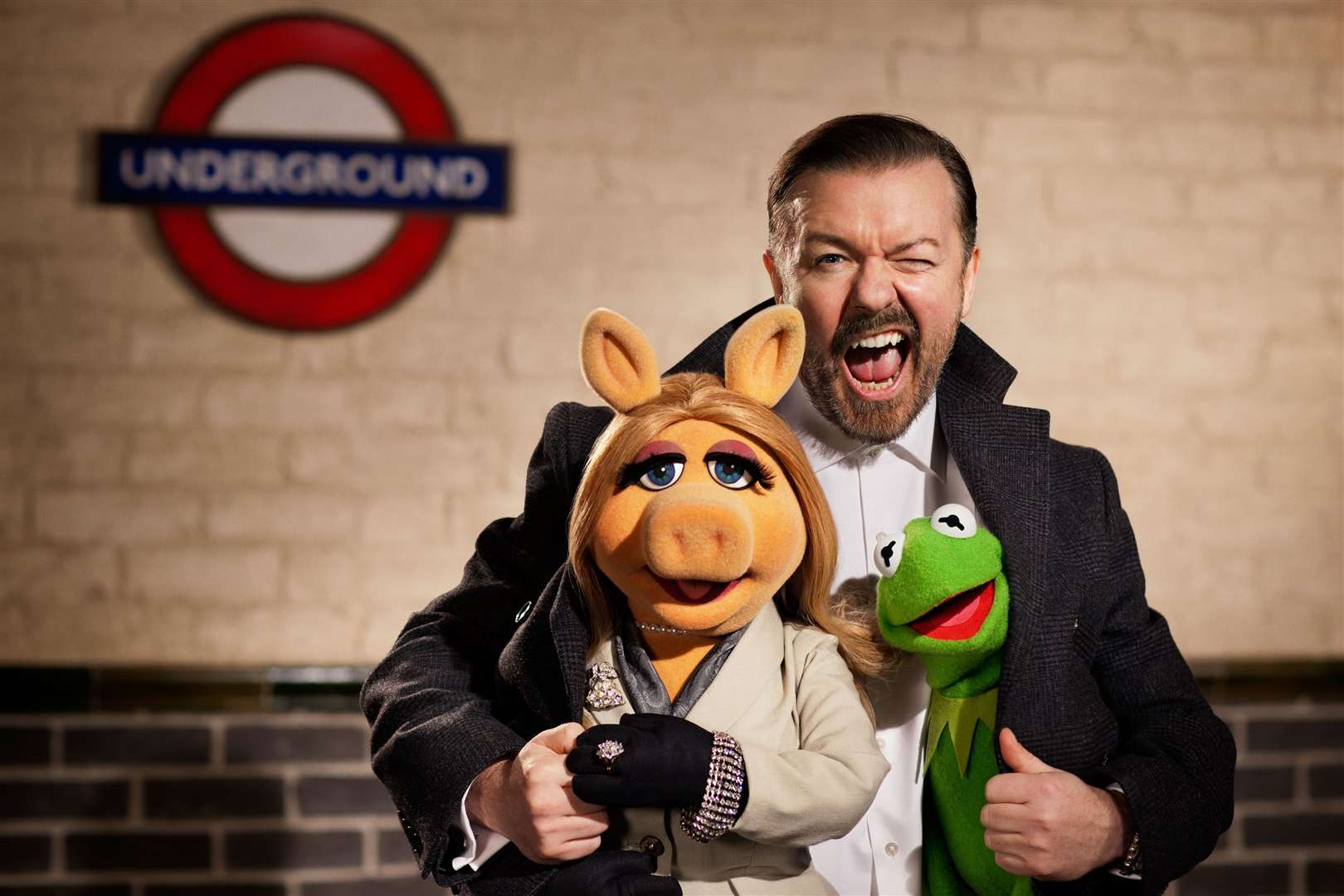Ricky Gervais as Dominic Badguy and Miss Piggy (voiced by Eric Jacobson), in Muppets Most Wanted. Picture: PA Photo/2013 Disney Enterprises, Inc
