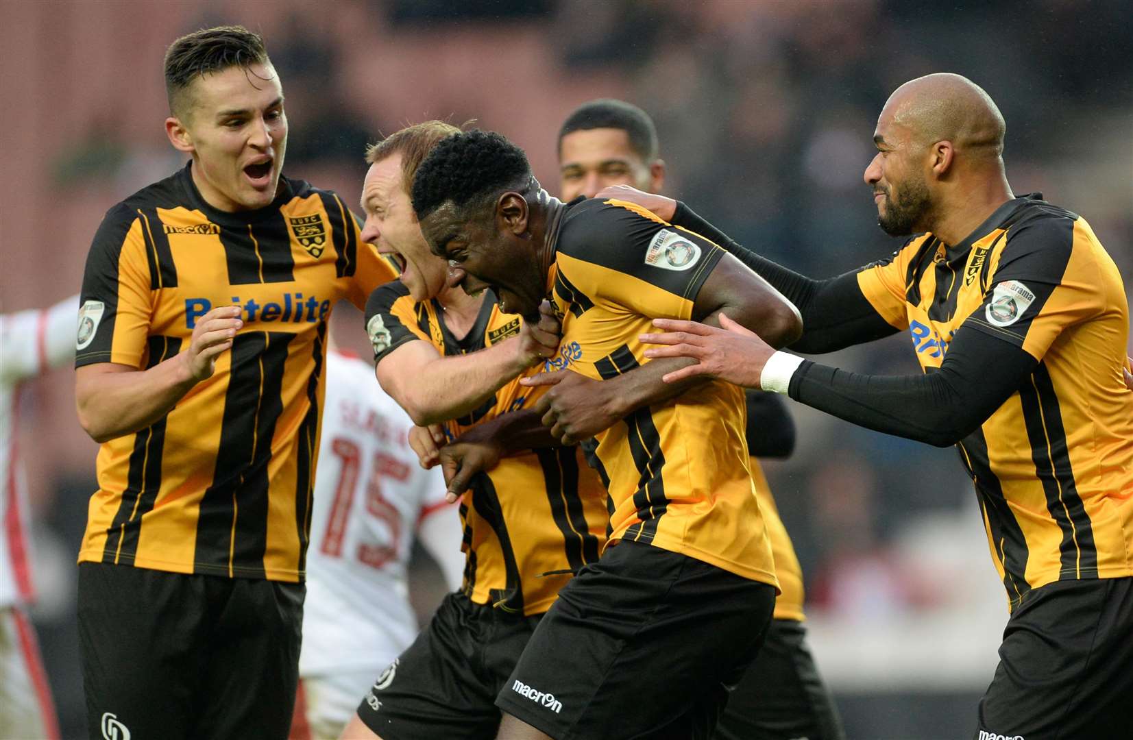 Magnus Okuonghae celebrates after scoring in Maidstone's FA Cup tie at MK Dons