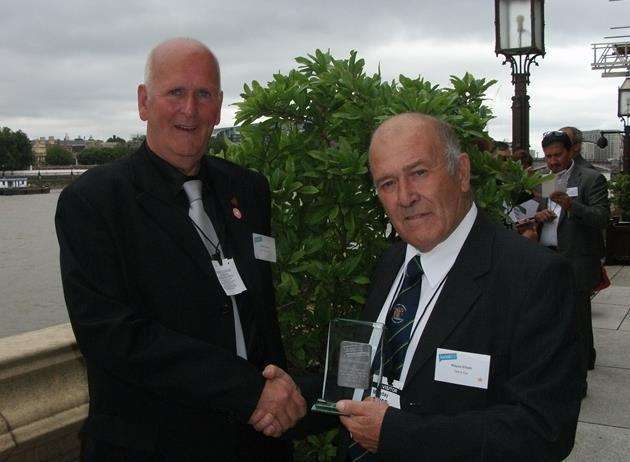 Cllr Wayne Elliott receiving a Locality public sector hero award in 2015, pictured with Cllr Adrian Friend