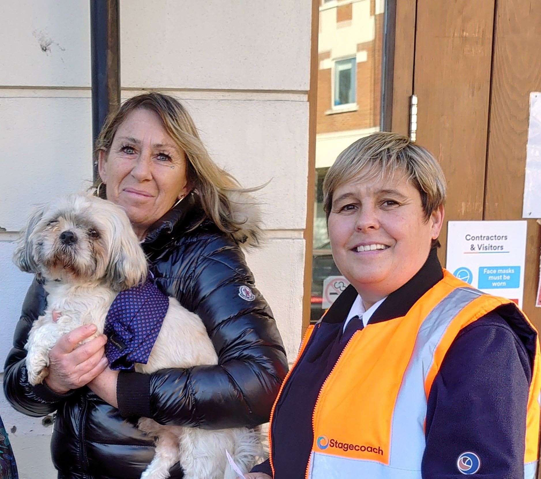 Owner Christine Ricketts reunited with Teddy at Canterbury bus station, with duty controller Glen Martin. Picture: Stagecoach