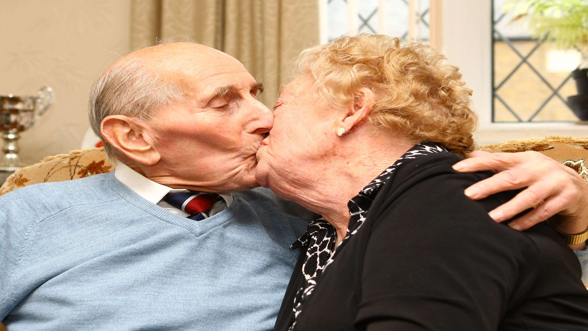 Sharing a kiss after 70 years of marriage