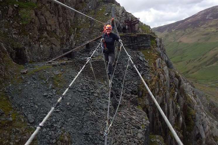 Walking a fine line - the Lake District way. Journalist Mary Louis on the new Infinity bridge at Honister Slate Mine, Borrowdale, some 2,000ft above the valley floor. Picture: Steve Hudson, Honister Slate Mine.