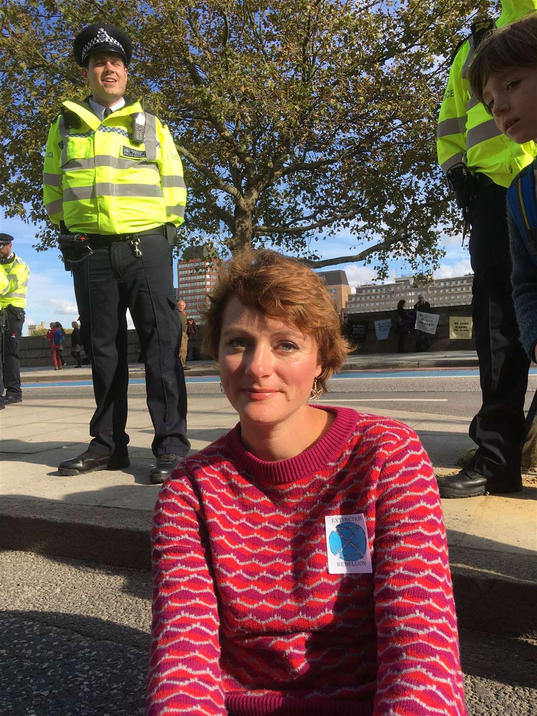 Laura Clout sitting in te cycle lane in Millbank, minutes before her arrest in 2019. Picture Carla Oxlade