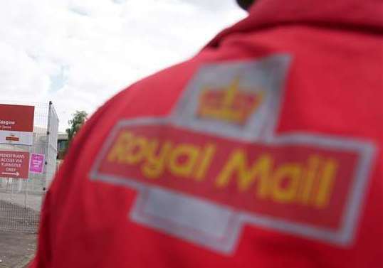 A Royal Mail postman has revealed his experience of working for the firm