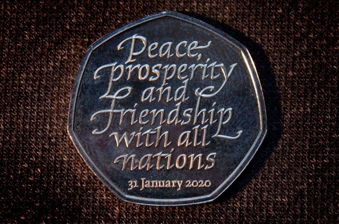 The 50p piece bears the inscription "peace, prosperity and friendship with all nations"