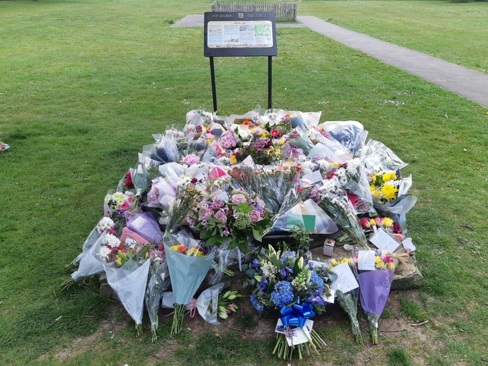 Floral tributes built up in a memorial site in the centre Aylesham for Julia James. This scene was photographed three days after the murder