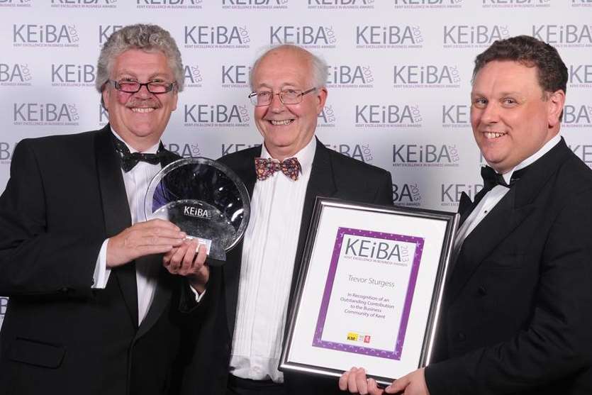 Outstanding Contribution Award: Trevor Sturgess, centre, of the KM Group, with Cllr Mark Dance, left, and Richard Elliot