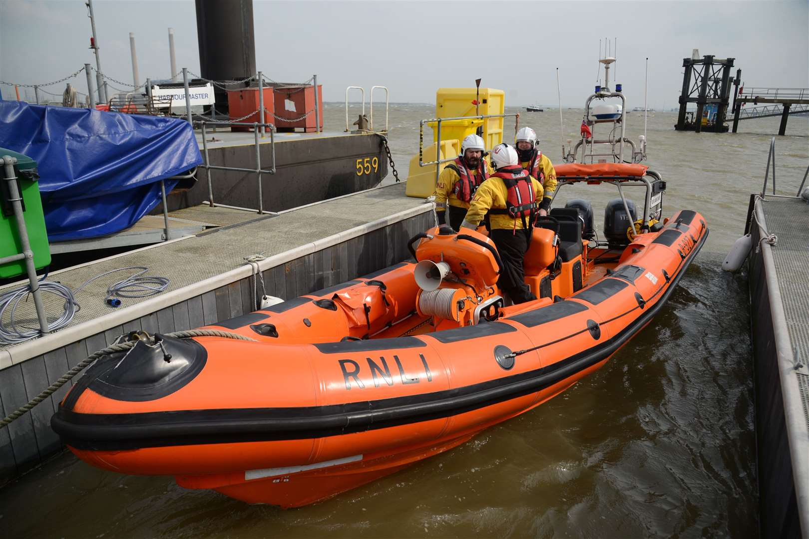 Volunteer crew members Alan Carr, Peter Birthright, Stewart Challis preparing the lifeboat. Picture: Gary Browne