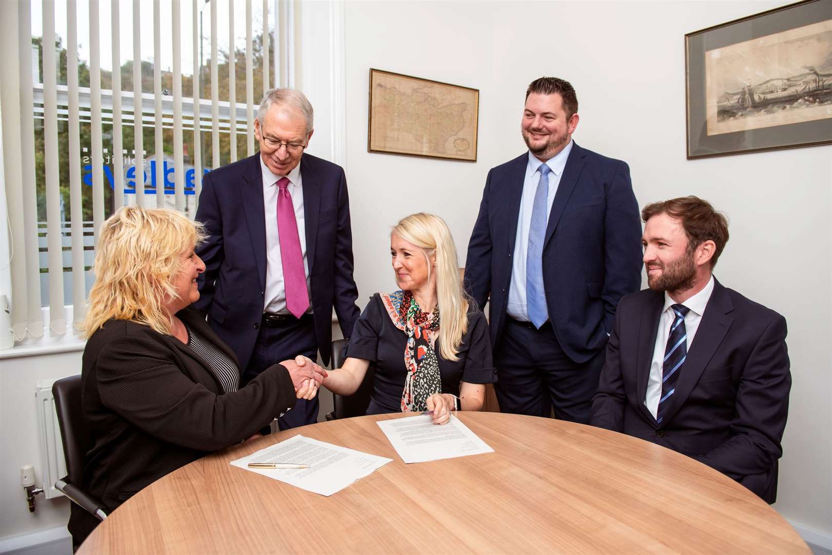 The deal is done: from left, Maureen Potts, Robert Green, Amy Judge, James Kent and Lachan Donaldson