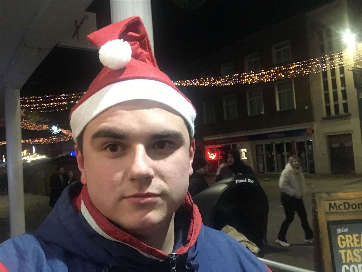 Reporter Max Chesson sporting a Santa hat outside what was previously dubbed 'Kent's rowdiest McDonald's'