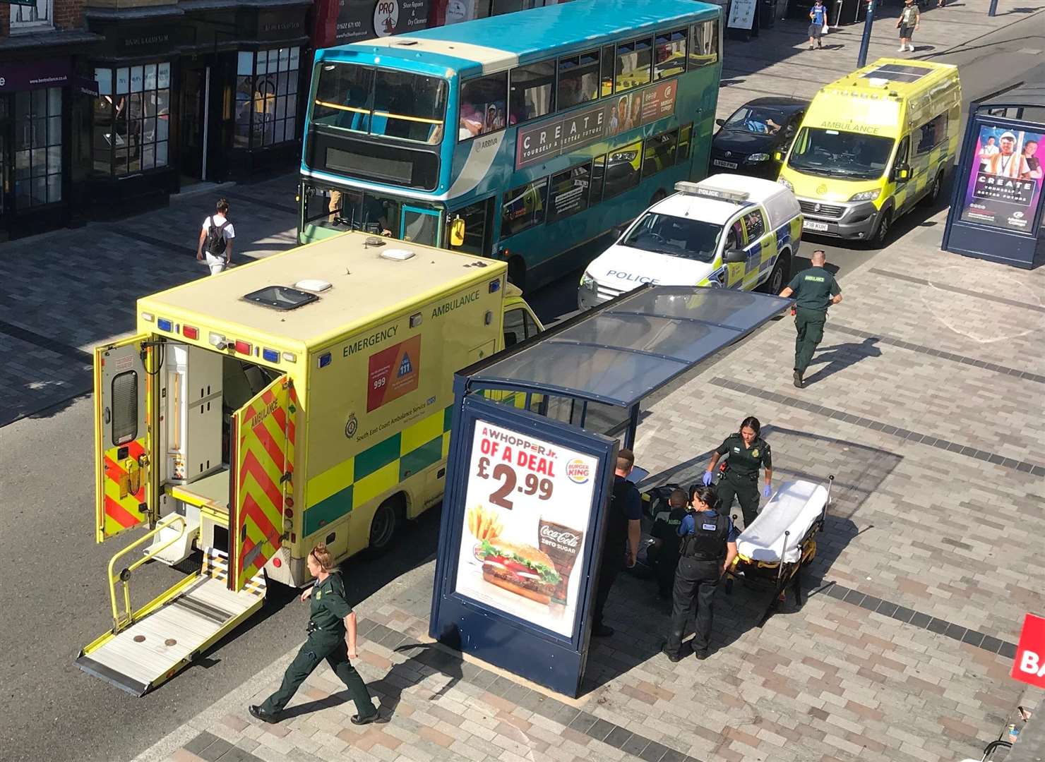 Police and medics are treating a woman who collapsed in Maidstone's High Street