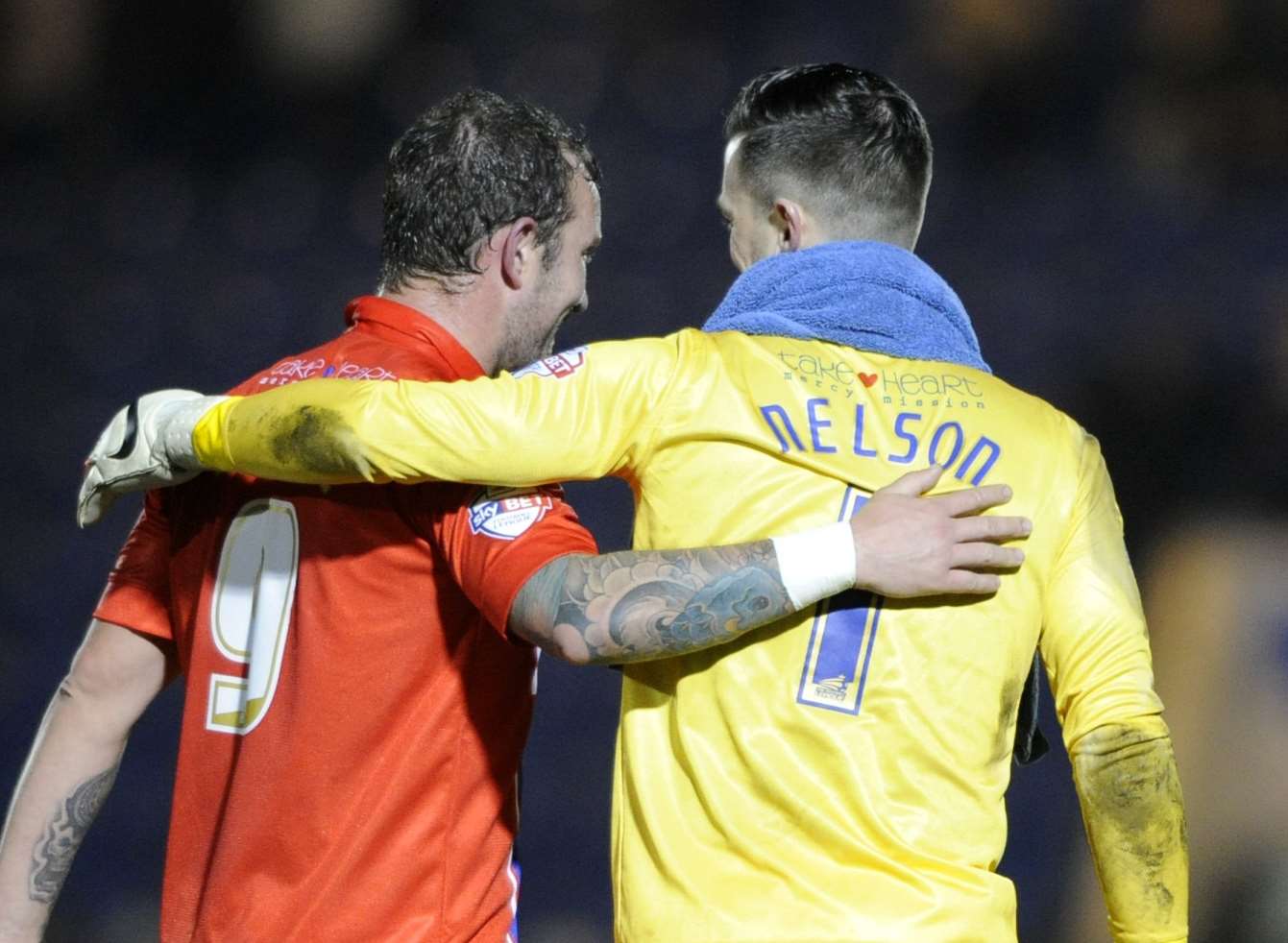 Danny Kedwell and Stuart Nelson share a moment after victory at Colchester Picture: Barry Goodwin