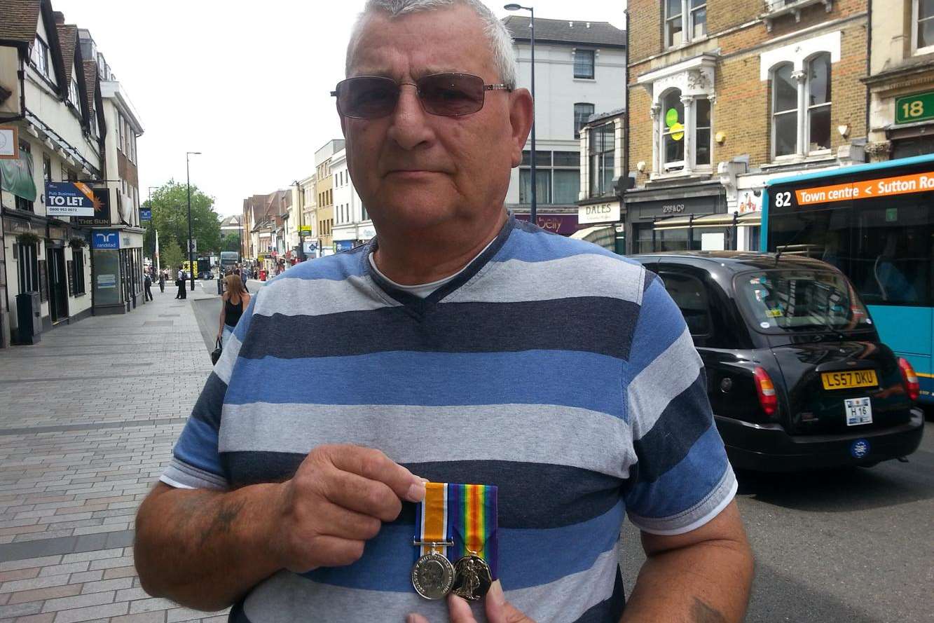 Peter Cook with his grandfather's medals