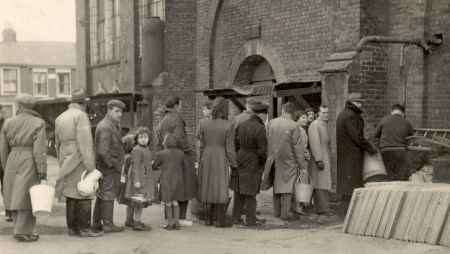 JOIN THE LINE: Queueing for fresh water at the pumping station in Trinity Road, Sheerness