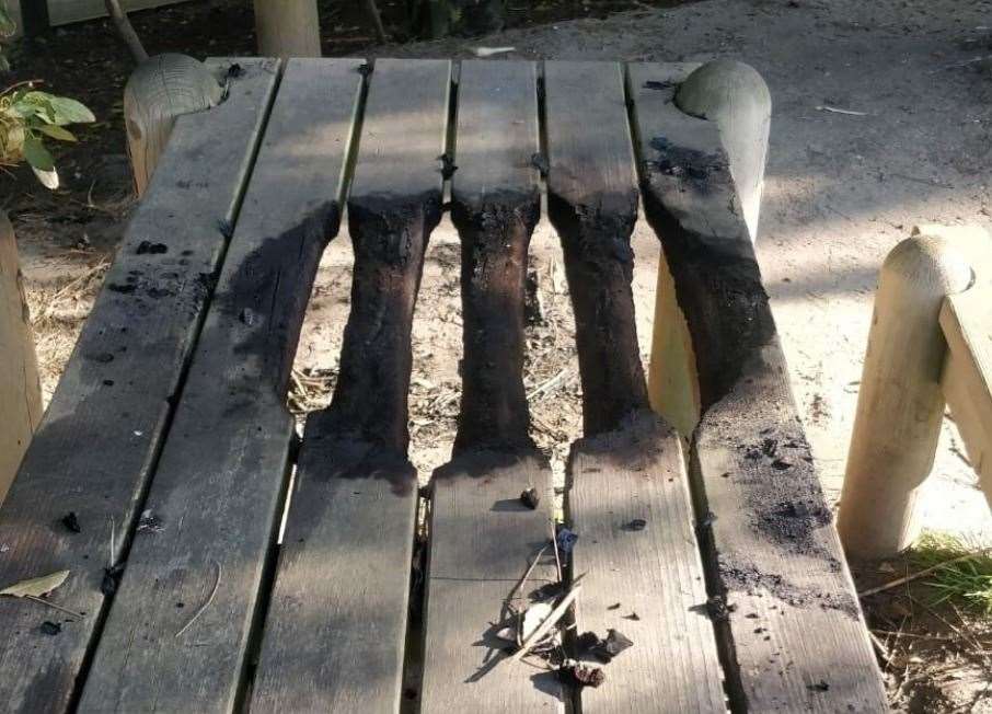 A picnic table in the Lower Leas Coastal Park was damaged after people had a barbecue last summer. The council has now banned them. Picture: FHDC