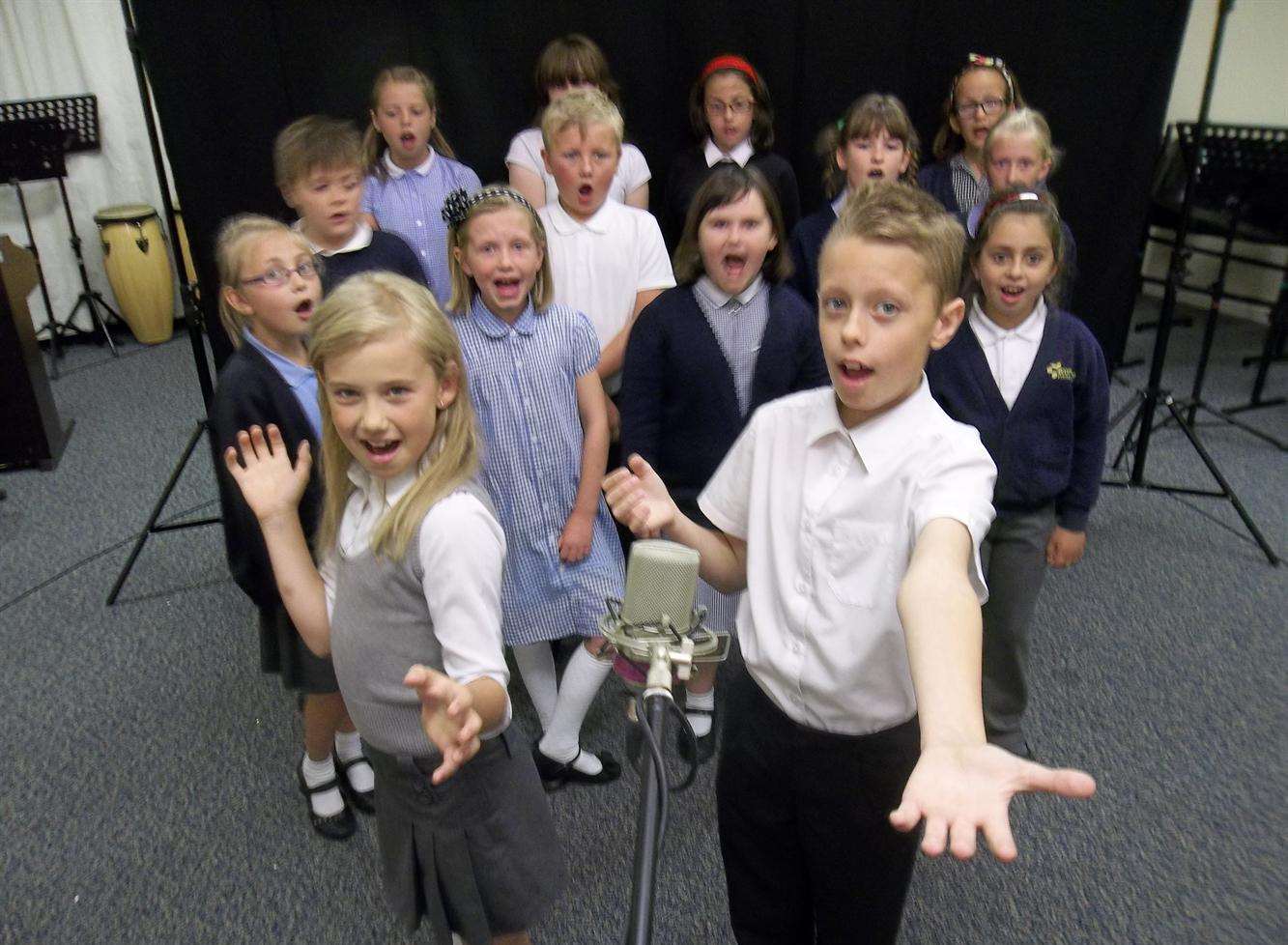 Isabel, seven, and Daniel, 11, of Bromstone Primary School, Thanet, take part in the finals of the 2014 KM Walk to School Song Contest. The school was named the winner of the annual contest