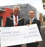 Mayor Barrie Wigg presents a cheque to director Richard Whistler