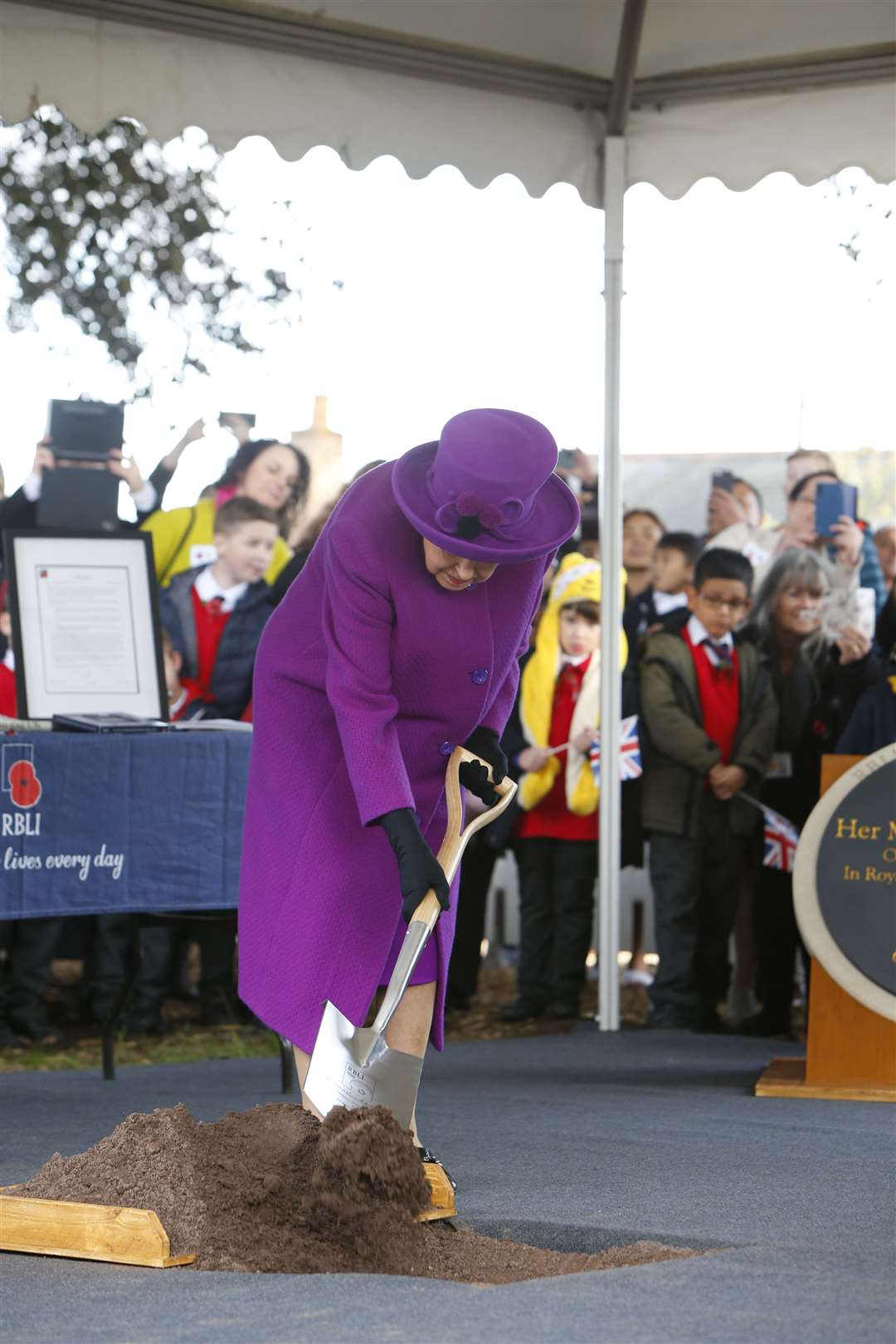 Her Majesty The Queen getting invovled when she visited the RBLI village last year.Picture: Andy Jones