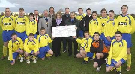 Dr Annette Doherty presents the cheque to club chairman Jeff Franklin. Picture: CHRIS DAVEY