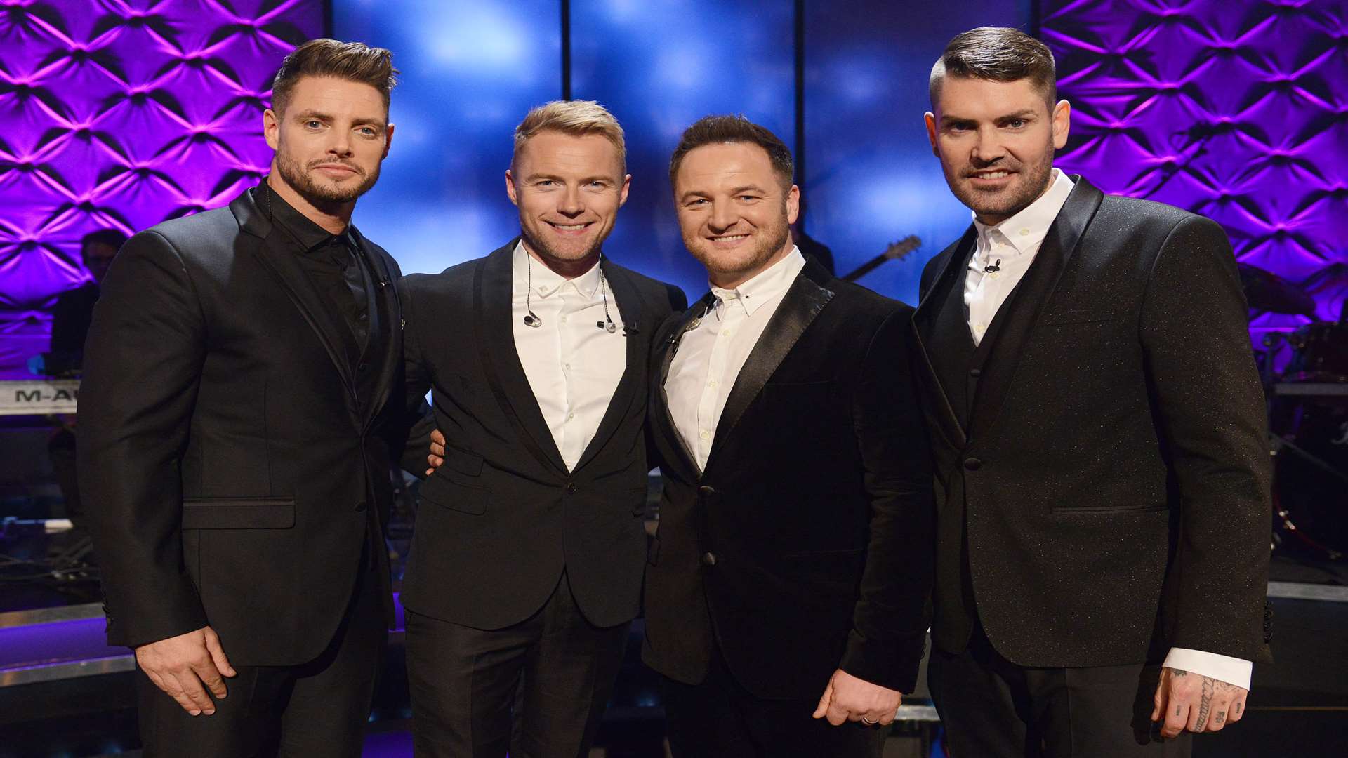 Shane, right, appearing with his Boyzone bandmates