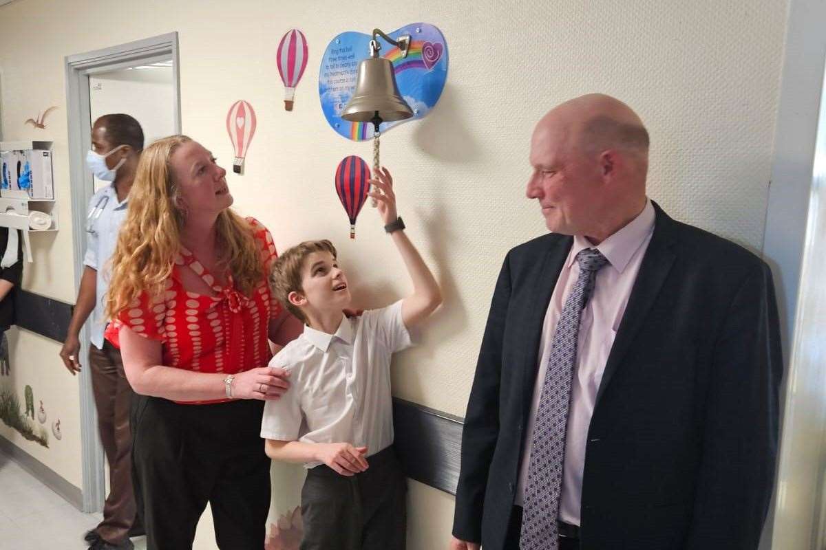 Samuel ringing the bell at the William Harvey Hospital in Ashford to mark the end of his chemotherapy treatment