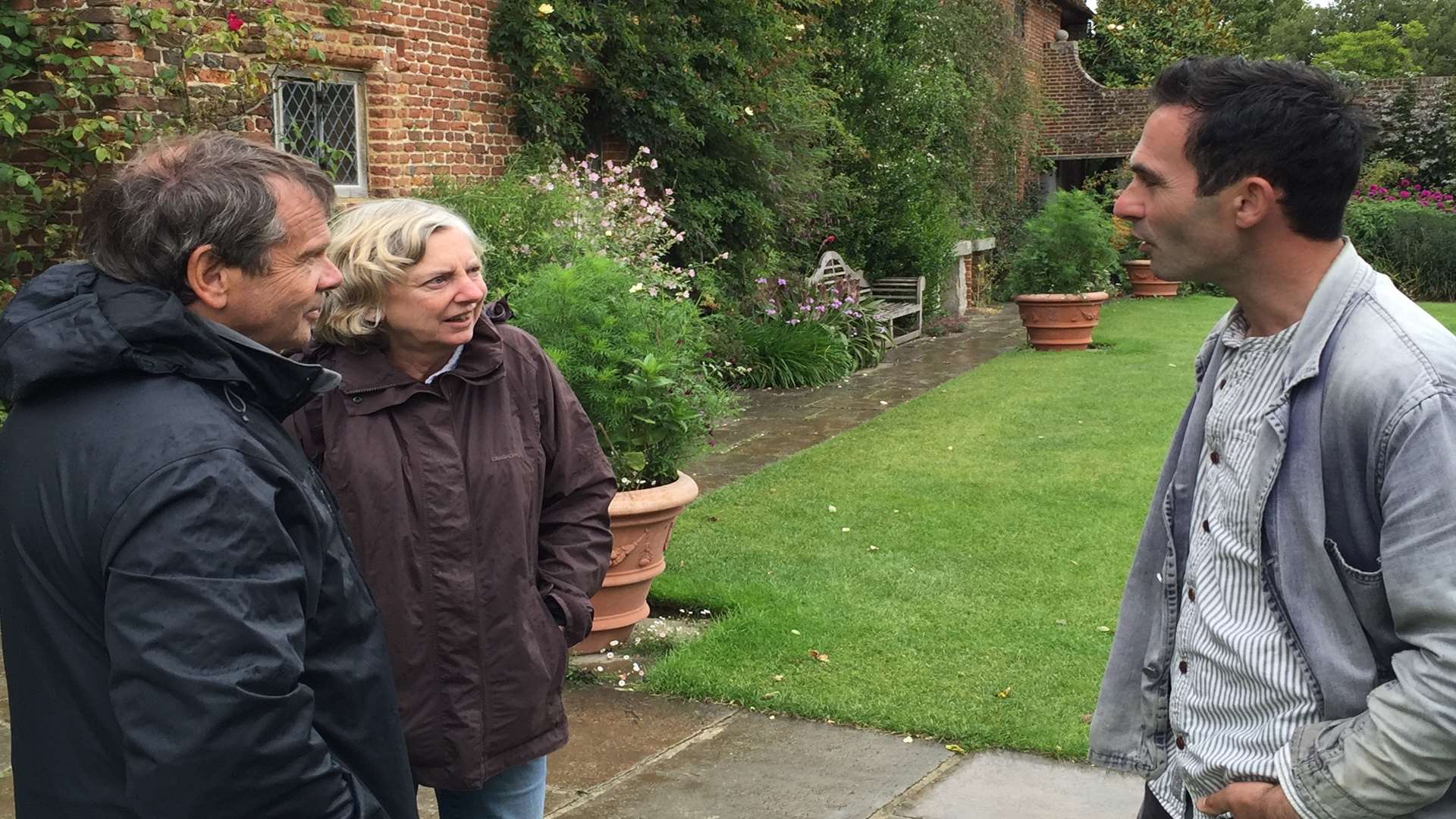 Head gardener Troy Scott Smith talks to visitors Jenny and Chris Harvey