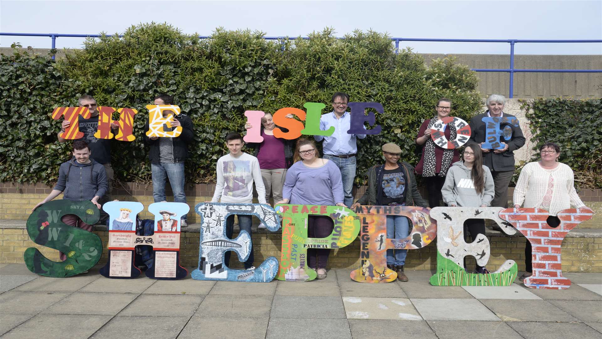 Students, volunteers and staff with the letters for the Sheppey Matters Blank Canvas art project