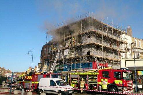 Firefighters tackle the flats blaze. Picture: @junedogrichard