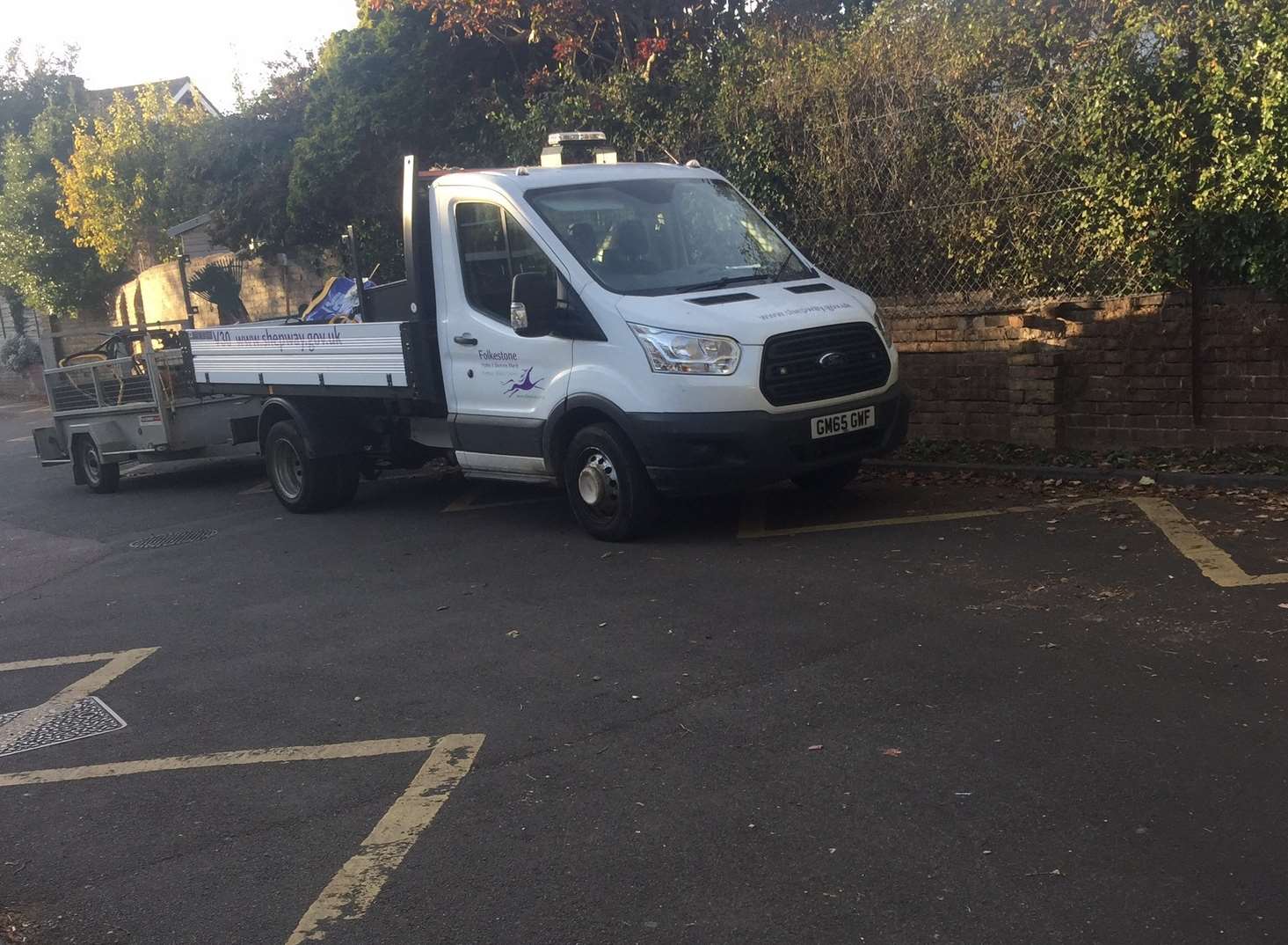 A Shepway District Council truck parked on yellow 'no parking' lines outside St Mary's Primary Academy, Folkestone