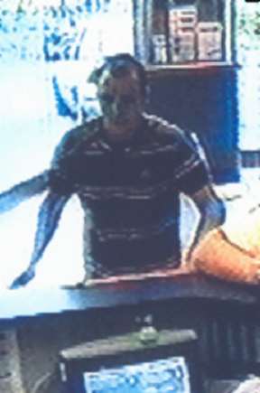 CCTV pic appeal for robbery at William Hill, Ashford