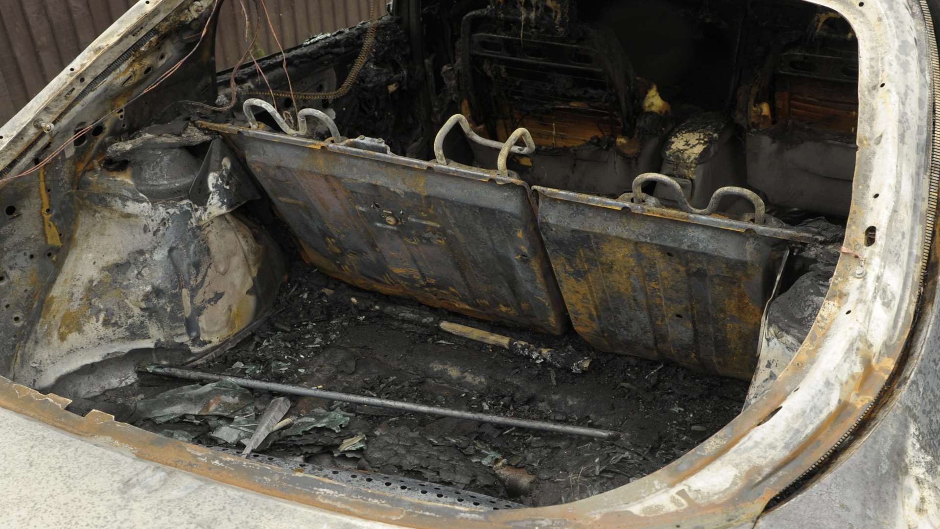 One of the burnt out cars in Larkspur Road, Walderslade